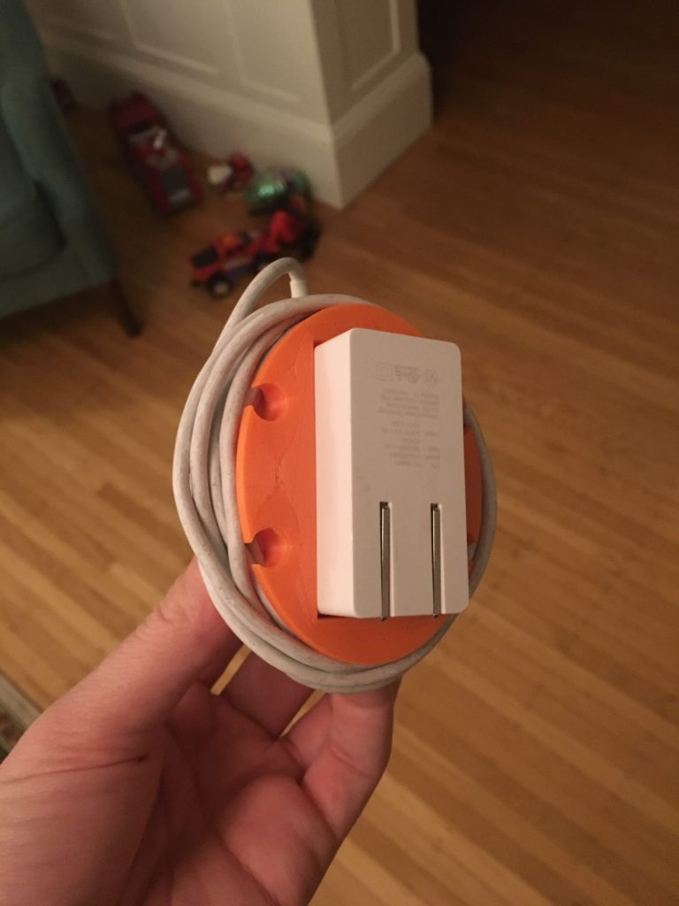 A simple 3d-printed cable wrap for the Pixelbook AC adapter.