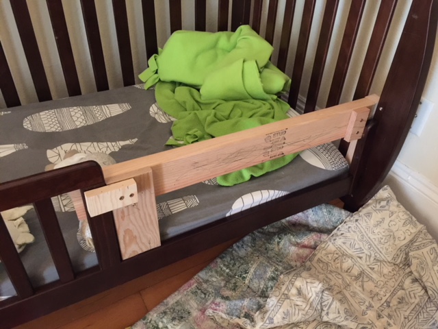 A DIY bed railing for a toddler bed